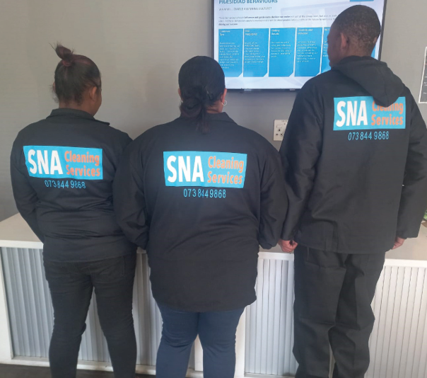 Professional cleaners preparing a luxury office space